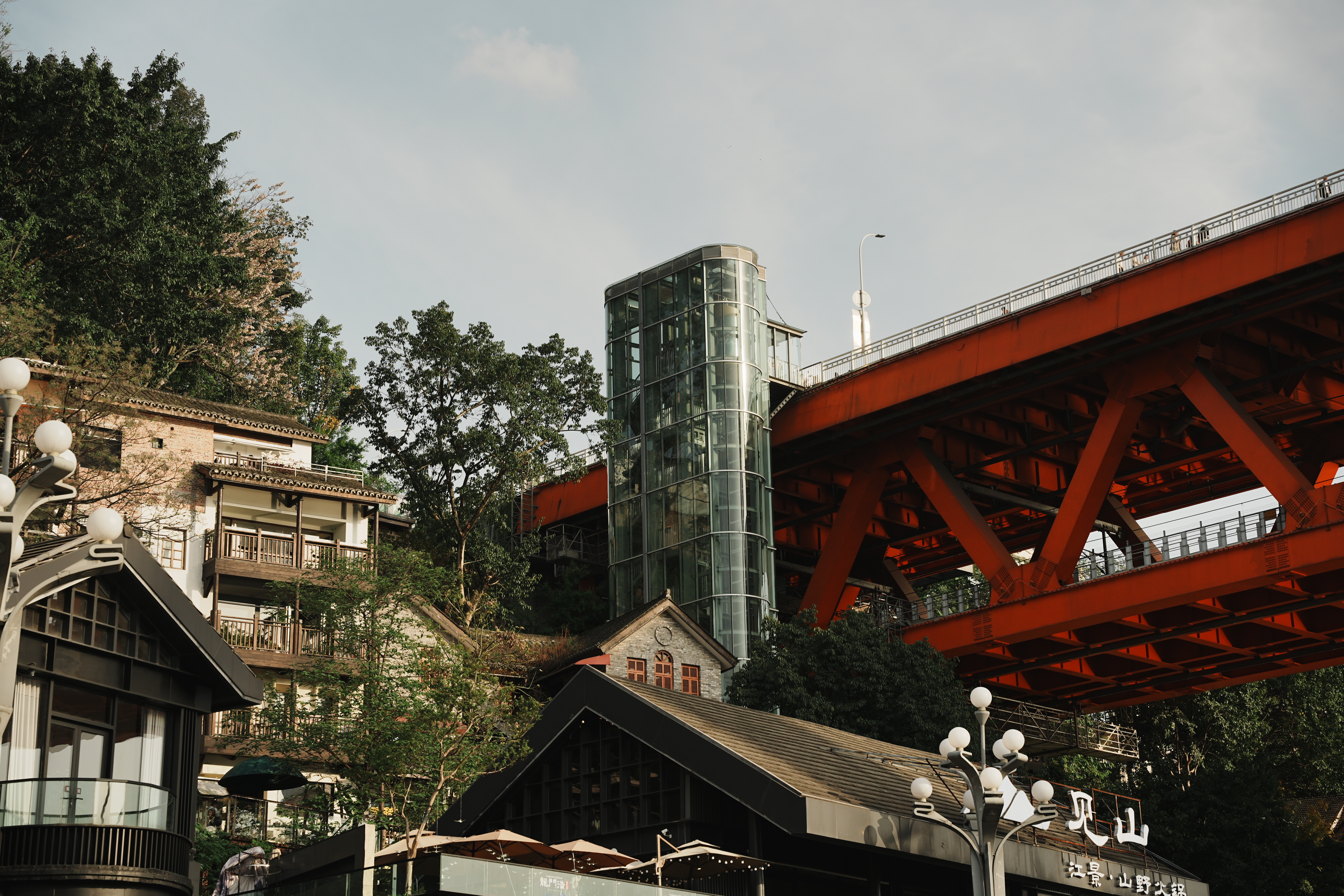 chongqing bridge entry, glass elevator, houses on slope